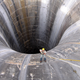 Illustration for article titled These 21 Enormous Man Made Holes Will Give You Vertigo